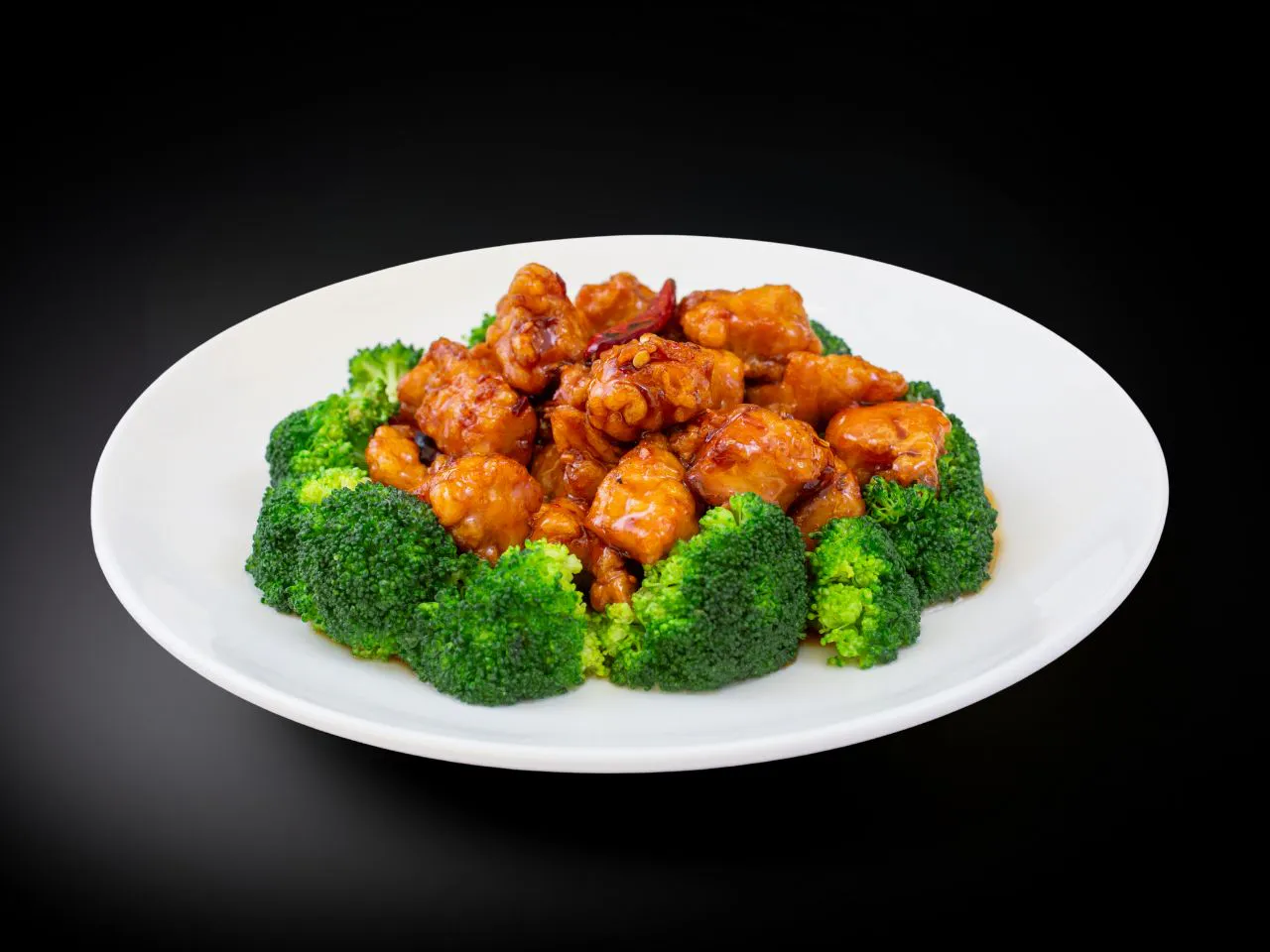 Crispy general tso's chicken with dried chili and fresh broccoli florets
