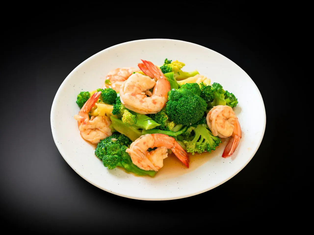 Stir‑fried jumbo shrimp with tender broccoli and mixed colorful vegetables